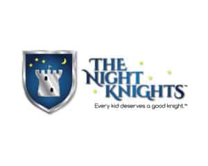 The Night Knights logo design featuring a metallic blue shield and castle—designed by Inspiring Design Co. to convey trust, security, and a noble mission for children’s well-being.