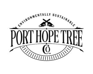 Port Hope Tree Co. logo design featuring vintage-style typography and crossed chainsaws—designed by Inspiring Design Co. to emphasize sustainability, craftsmanship, and tree care expertise.